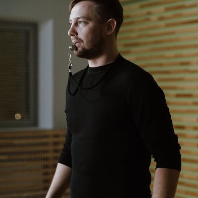 Professional instructor Myroslava Stepanenko smiling in a sports outfit.