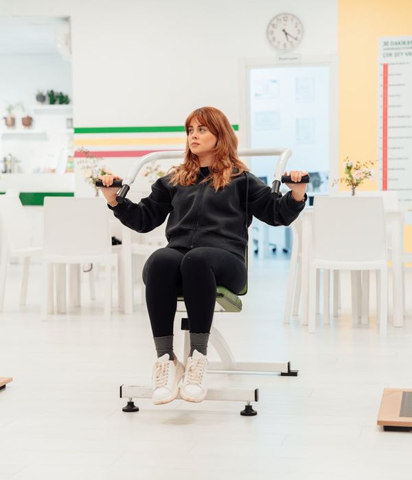 Young woman doing morning cardio exercises in a bright minimalist room.